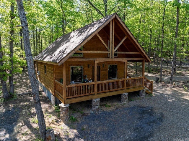 892 Hwy 375 E, Mena, AR 71953 - log cabin featuring a forest view