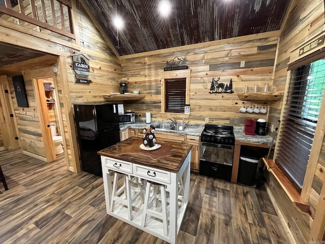 892 Hwy 375 E, Mena, AR 71953 - kitchen featuring open shelves, wood counters, wood walls, black appliances, and dark wood-style floors
