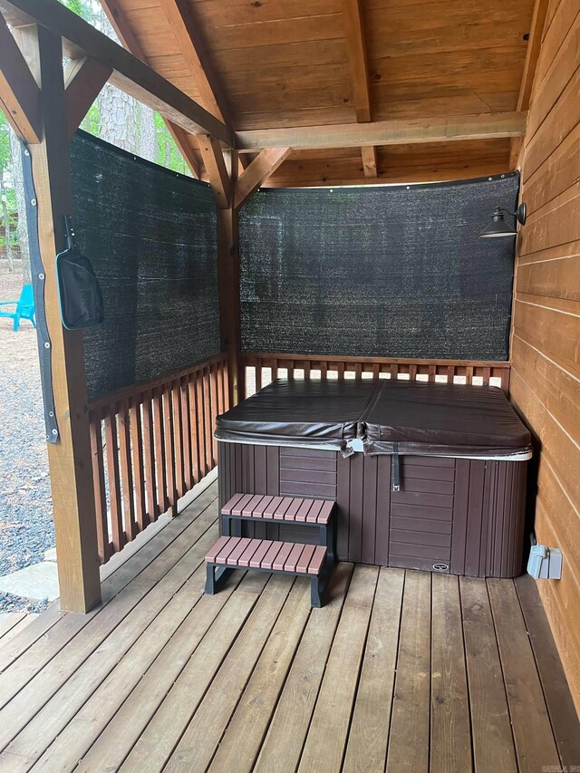 892 Hwy 375 E, Mena, AR 71953 - wooden deck with a hot tub