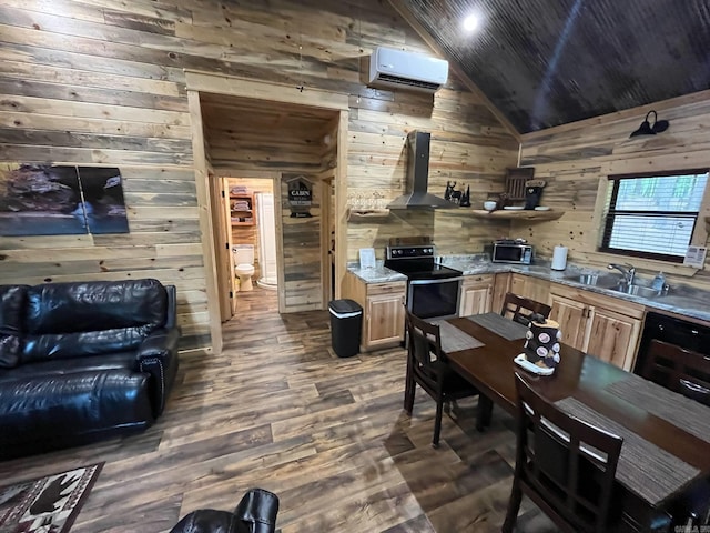 892 Hwy 375 E, Mena, AR 71953 - kitchen featuring a wall mounted air conditioner, exhaust hood, vaulted ceiling, wooden walls, and appliances with stainless steel finishes