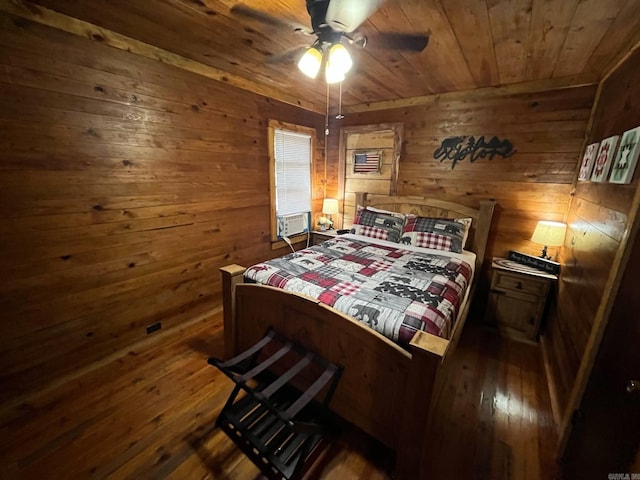 892 Hwy 375 E, Mena, AR 71953 - bedroom with dark wood finished floors, wood walls, and wood ceiling