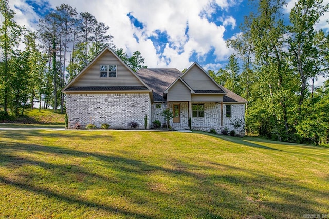 craftsman inspired home with a front yard and brick siding