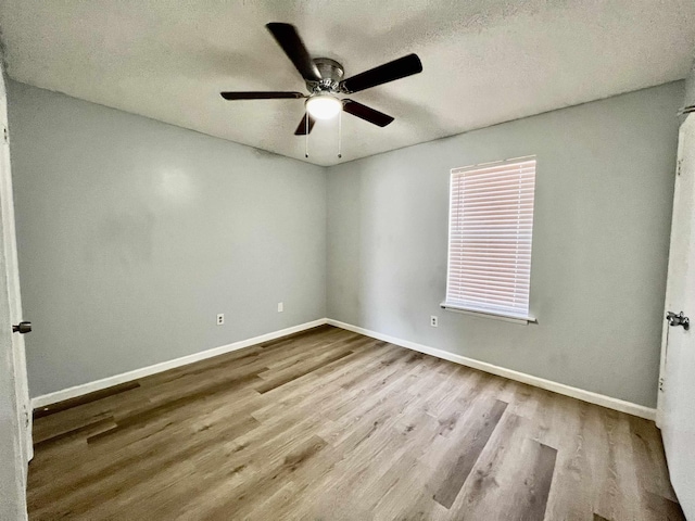 1906 W Matthews Ave, Jonesboro, AR 72401 - spare room with a textured ceiling, baseboards, a ceiling fan, and wood finished floors
