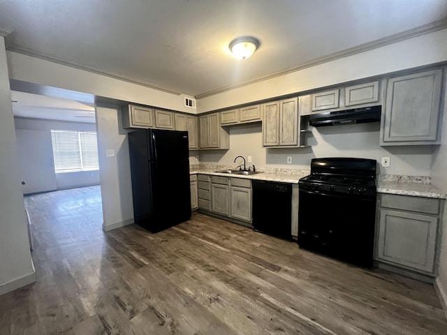 1906 W Matthews Ave, Jonesboro, AR 72401 - kitchen with a sink, ornamental molding, black appliances, under cabinet range hood, and light countertops