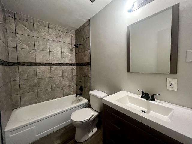 1906 W Matthews Ave, Jonesboro, AR 72401 - full bath with bathtub / shower combination, toilet, wood finished floors, and vanity