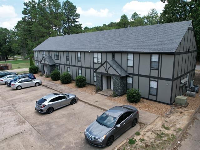 1906 W Matthews Ave, Jonesboro, AR 72401 - view of property with uncovered parking and central air condition unit
