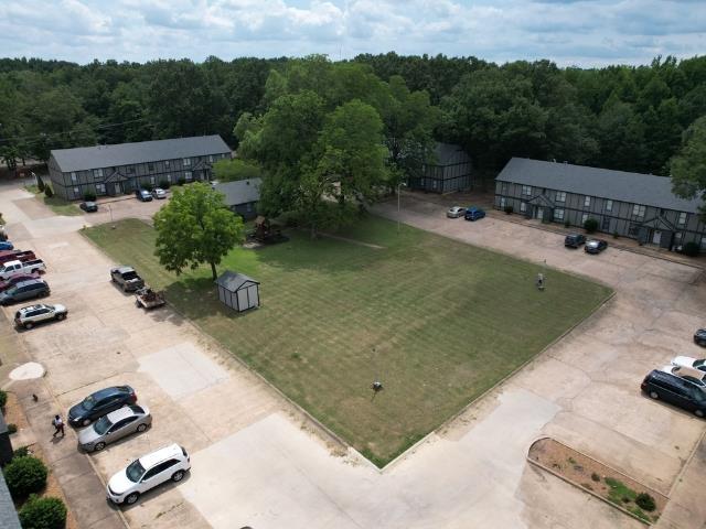1906 W Matthews Ave, Jonesboro, AR 72401 - drone / aerial view featuring a forest view