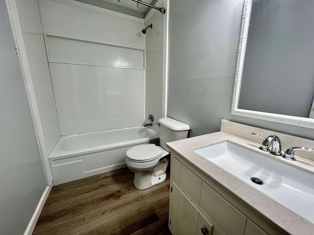 1906 W Matthews Ave, Jonesboro, AR 72401 - bathroom with toilet, vanity, tub / shower combination, and wood finished floors