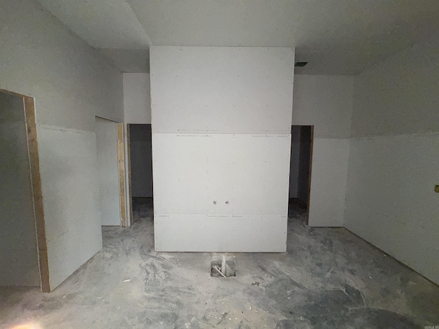 unfurnished room with concrete floors