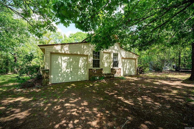 1494 N Miller Point Rd, Quitman, AR 72131 - exterior space featuring an outdoor structure and a garage