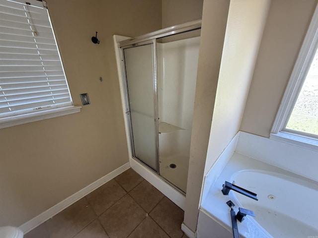 13506 Dynasty Dr, Alexander, AR 72002 - full bathroom featuring tile patterned flooring, a garden tub, a shower stall, and baseboards