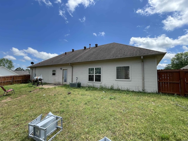 13506 Dynasty Dr, Alexander, AR 72002 - back of house featuring a patio, central AC, a fenced backyard, a yard, and roof with shingles