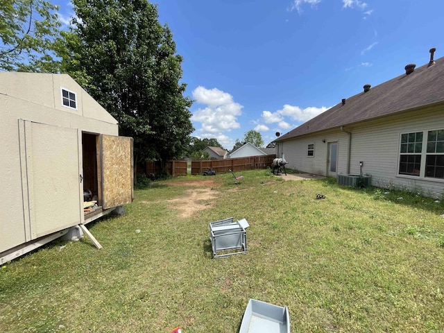 13506 Dynasty Dr, Alexander, AR 72002 - view of yard with central air condition unit, an outdoor structure, fence, and a storage unit