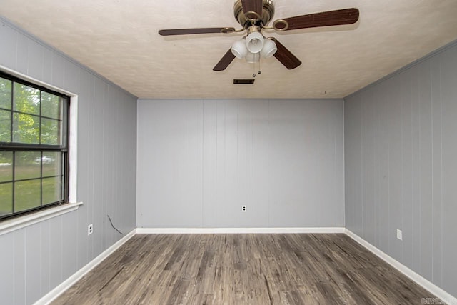 1400 S Rose St, Sheridan, AR 72150 - unfurnished room featuring baseboards, visible vents, a ceiling fan, and wood finished floors