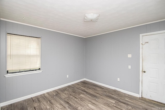 1400 S Rose St, Sheridan, AR 72150 - empty room with crown molding, baseboards, and wood finished floors