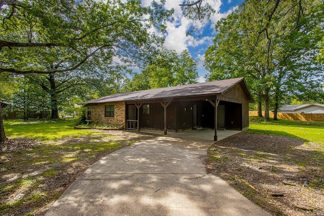 1400 S Rose St, Sheridan, AR 72150 - exterior space with a front lawn, driveway, fence, and an attached carport