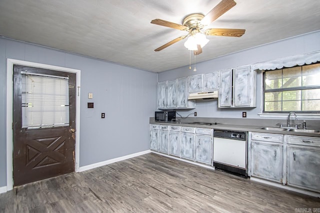 1400 S Rose St, Sheridan, AR 72150 - kitchen featuring a sink, under cabinet range hood, ceiling fan, black microwave, and white dishwasher