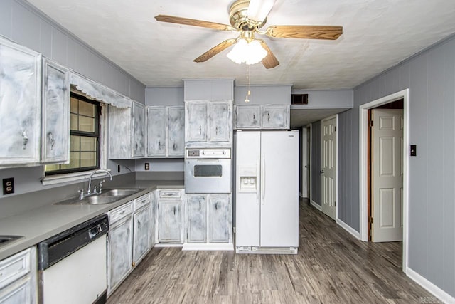 1400 S Rose St, Sheridan, AR 72150 - kitchen with a sink, white appliances, wood finished floors, ornamental molding, and ceiling fan
