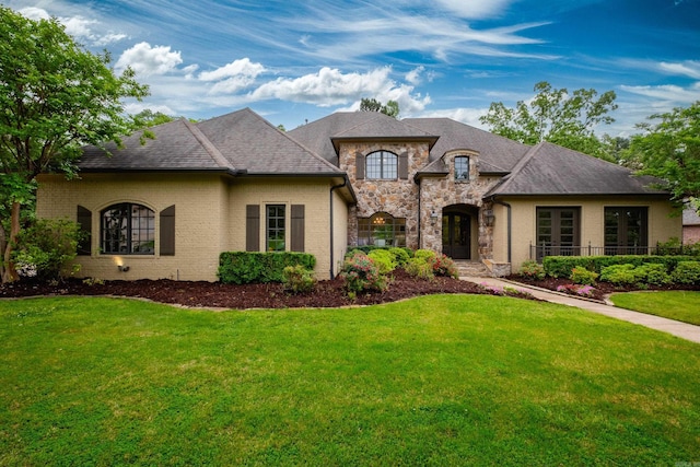 44 Deauville Cir, Little Rock, AR 72223 - french provincial home with a front yard and stone siding