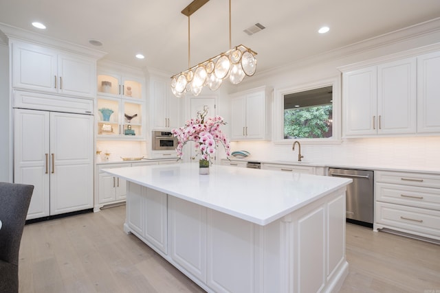 44 Deauville Cir, Little Rock, AR 72223 - kitchen with white cabinetry, appliances with stainless steel finishes, a kitchen island, and a sink