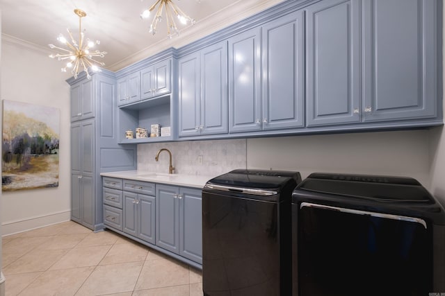 44 Deauville Cir, Little Rock, AR 72223 - washroom featuring a sink, cabinet space, washing machine and clothes dryer, an inviting chandelier, and light tile patterned floors