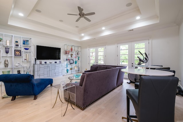 44 Deauville Cir, Little Rock, AR 72223 - living area featuring a wealth of natural light, french doors, a tray ceiling, and light wood-style floors