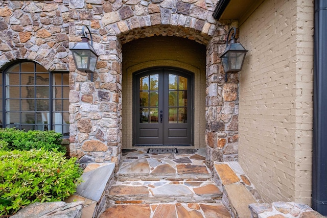 44 Deauville Cir, Little Rock, AR 72223 - doorway to property with stone siding and french doors