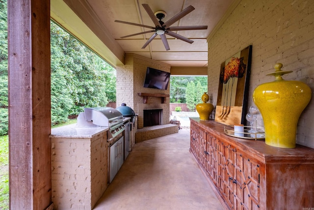 44 Deauville Cir, Little Rock, AR 72223 - view of patio with ceiling fan, grilling area, exterior kitchen, and an outdoor brick fireplace