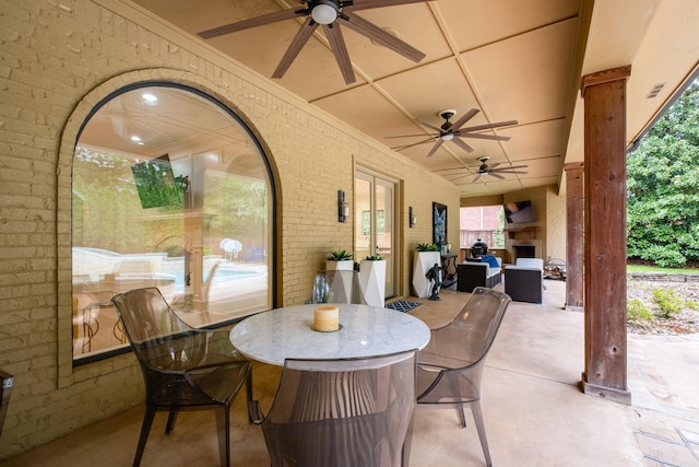 44 Deauville Cir, Little Rock, AR 72223 - view of patio with a ceiling fan, exterior fireplace, outdoor dining area, and visible vents