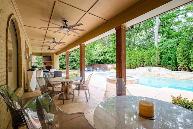 44 Deauville Cir, Little Rock, AR 72223 - view of patio / terrace featuring a ceiling fan, outdoor dining area, a pool with connected hot tub, fence private yard, and an outdoor fireplace