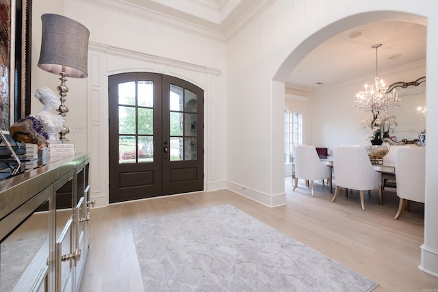 44 Deauville Cir, Little Rock, AR 72223 - entryway featuring light wood-type flooring, plenty of natural light, french doors, and arched walkways