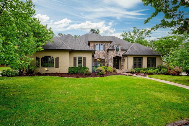 44 Deauville Cir, Little Rock, AR 72223 - french country style house with stone siding and a front lawn