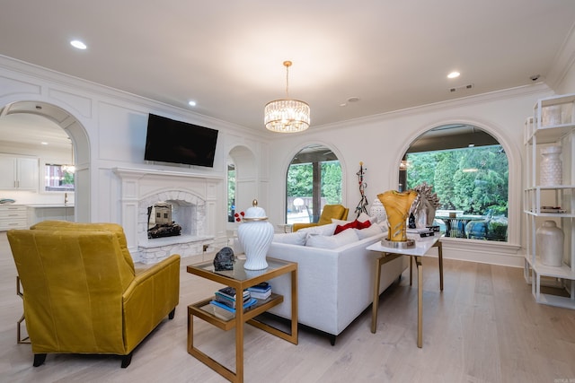 44 Deauville Cir, Little Rock, AR 72223 - living area featuring ornamental molding, a notable chandelier, a fireplace with raised hearth, and visible vents