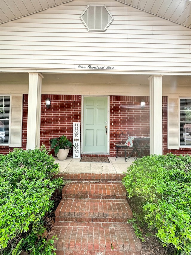 105 Liles, Searcy, AR 72143 - doorway to property with a porch and brick siding