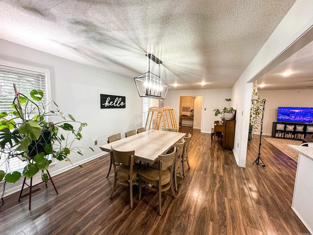 105 Liles, Searcy, AR 72143 - dining area featuring a textured ceiling, baseboards, dark wood-type flooring, and visible vents