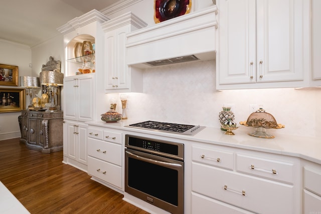 102 Falata Cir, Little Rock, AR 72223 - kitchen featuring stainless steel oven, wood finished floors, stovetop, light countertops, and custom range hood