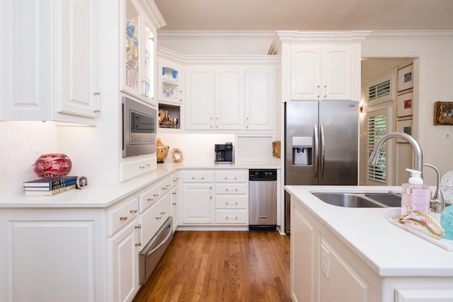 102 Falata Cir, Little Rock, AR 72223 - kitchen featuring a sink, a warming drawer, white cabinets, and appliances with stainless steel finishes