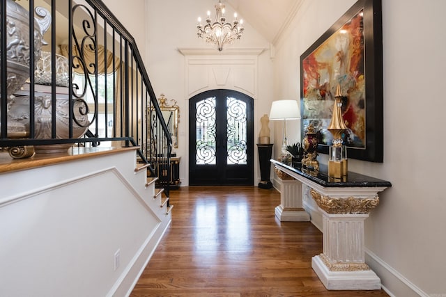 102 Falata Cir, Little Rock, AR 72223 - foyer featuring an inviting chandelier, stairway, wood finished floors, and high vaulted ceiling