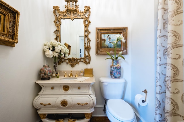102 Falata Cir, Little Rock, AR 72223 - bathroom featuring curtained shower, vanity, toilet, and baseboards