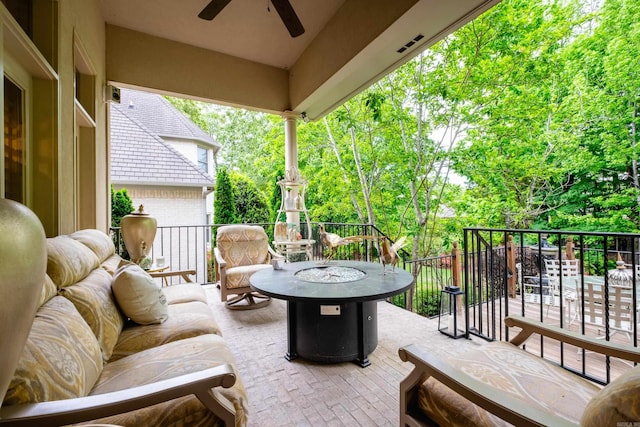 102 Falata Cir, Little Rock, AR 72223 - view of patio featuring an outdoor fire pit, a balcony, and a ceiling fan