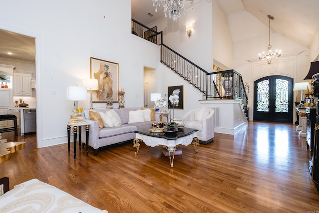 102 Falata Cir, Little Rock, AR 72223 - living area with stairway, a notable chandelier, high vaulted ceiling, and wood finished floors