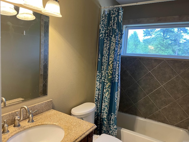 full bath with toilet, vanity, and shower / bathtub combination with curtain
