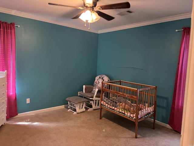 bedroom with baseboards, ornamental molding, carpet flooring, ceiling fan, and visible vents
