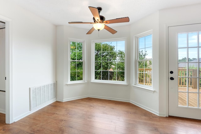 122 Apple Blossom Loop, Maumelle, AR 72113 - doorway to outside with ceiling fan, wood-type flooring, baseboards, and visible vents