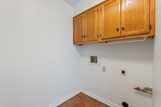 122 Apple Blossom Loop, Maumelle, AR 72113 - clothes washing area with cabinet space, washer hookup, hookup for an electric dryer, baseboards, and dark wood-style floors