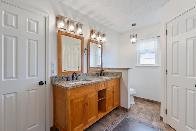 122 Apple Blossom Loop, Maumelle, AR 72113 - bathroom with double vanity, toilet, baseboards, and a sink