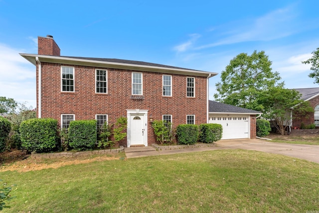 122 Apple Blossom Loop, Maumelle, AR 72113 - colonial inspired home with an attached garage, brick siding, concrete driveway, a front yard, and a chimney