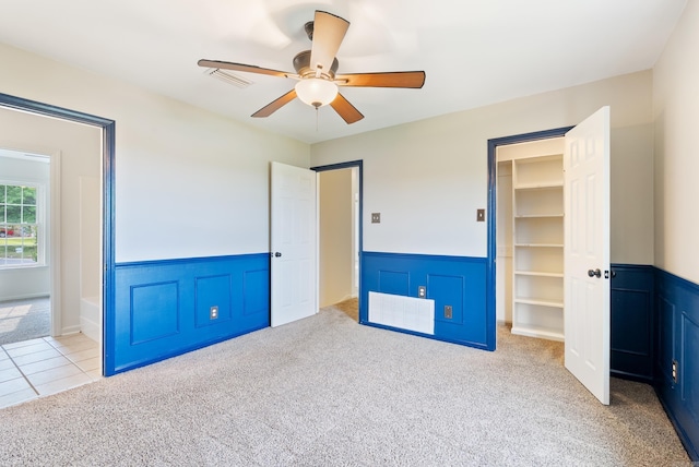 122 Apple Blossom Loop, Maumelle, AR 72113 - unfurnished bedroom with a ceiling fan, carpet floors, visible vents, wainscoting, and a spacious closet