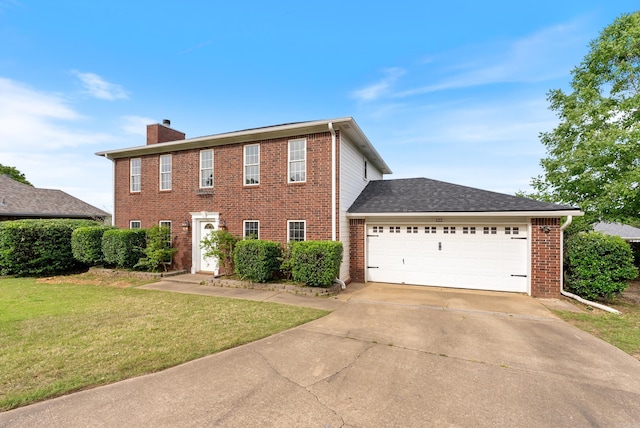 122 Apple Blossom Loop, Maumelle, AR 72113 - colonial-style house featuring a front lawn, brick siding, a chimney, and a garage