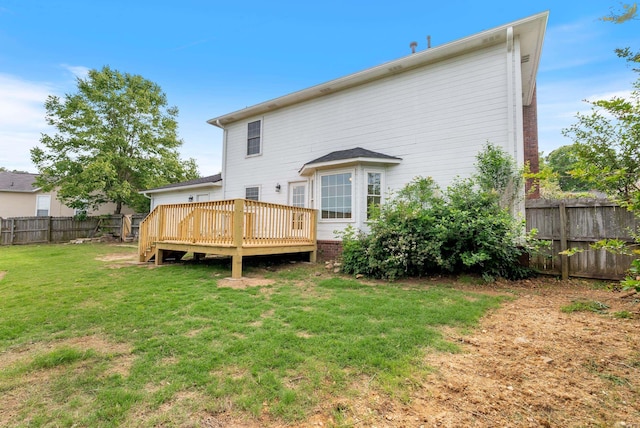 122 Apple Blossom Loop, Maumelle, AR 72113 - back of property with fence, a wooden deck, and a lawn